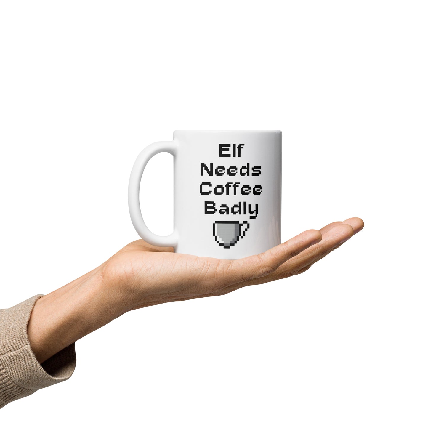 White 11oz retro coffee mug featuring an ‘Elf Needs Coffee Badly’ video game design with handle on the left.