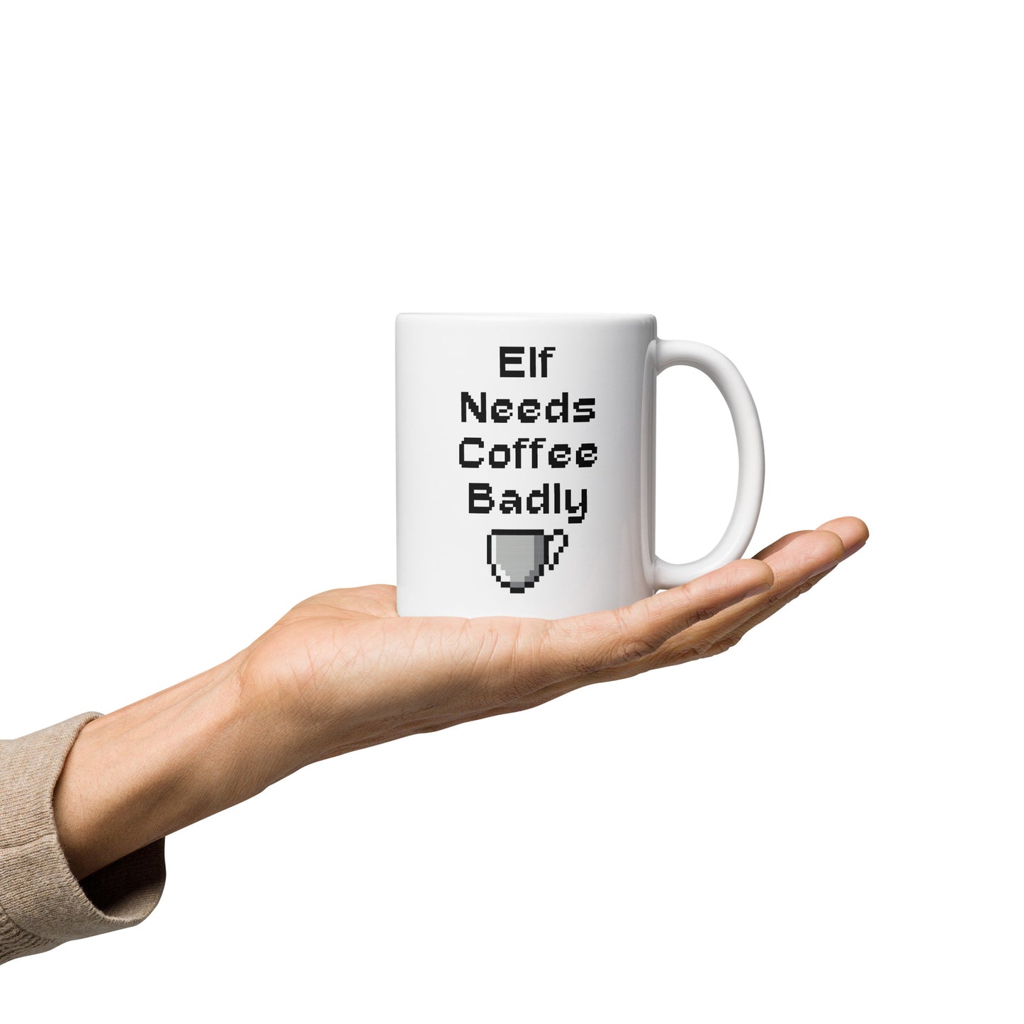 White 11oz retro coffee mug featuring an ‘Elf Needs Coffee Badly’ video game design with handle on the right.