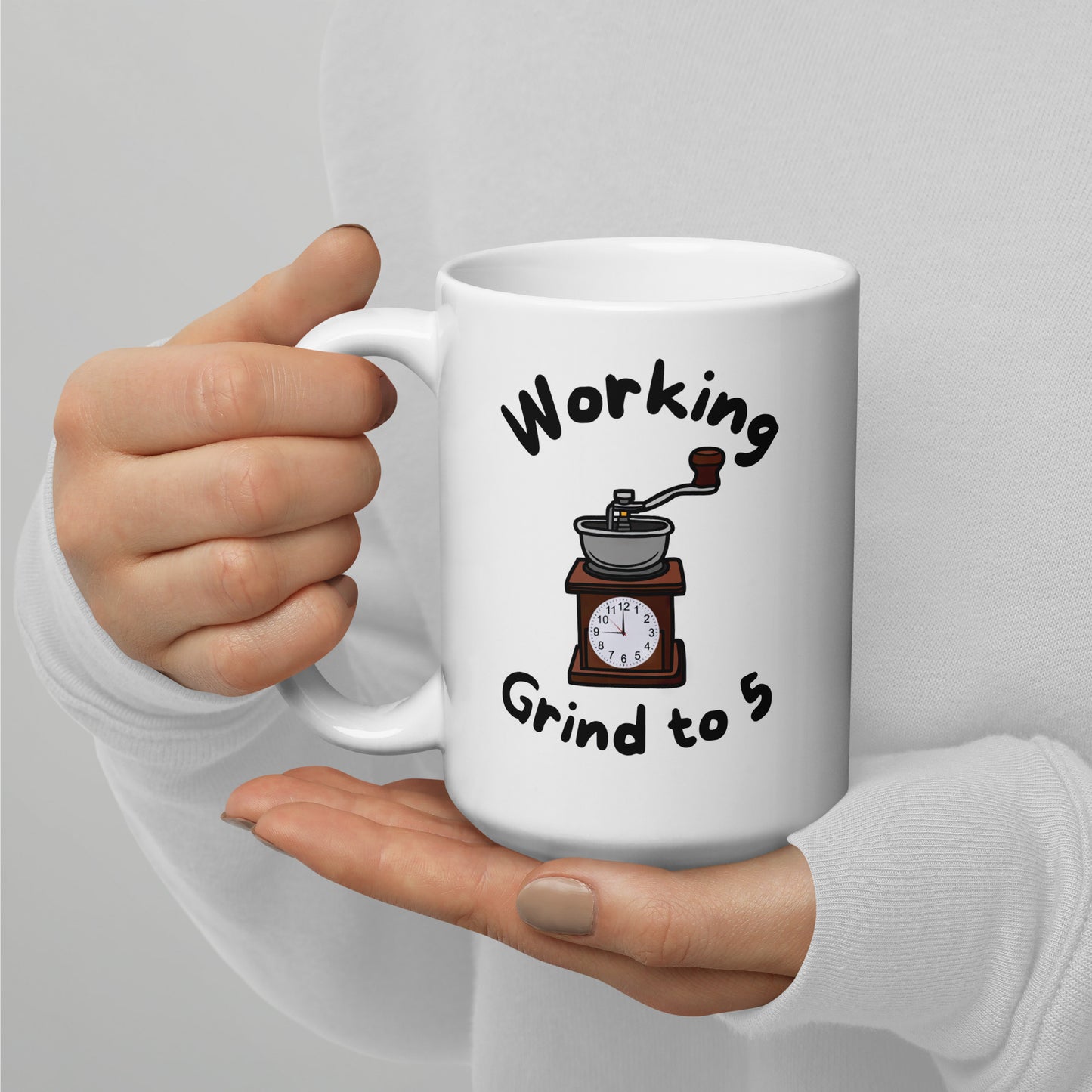White 15oz tech humor coffee mug with a coffee grinder with a clock face and slogan that says, ‘Working Grind to 5’.
