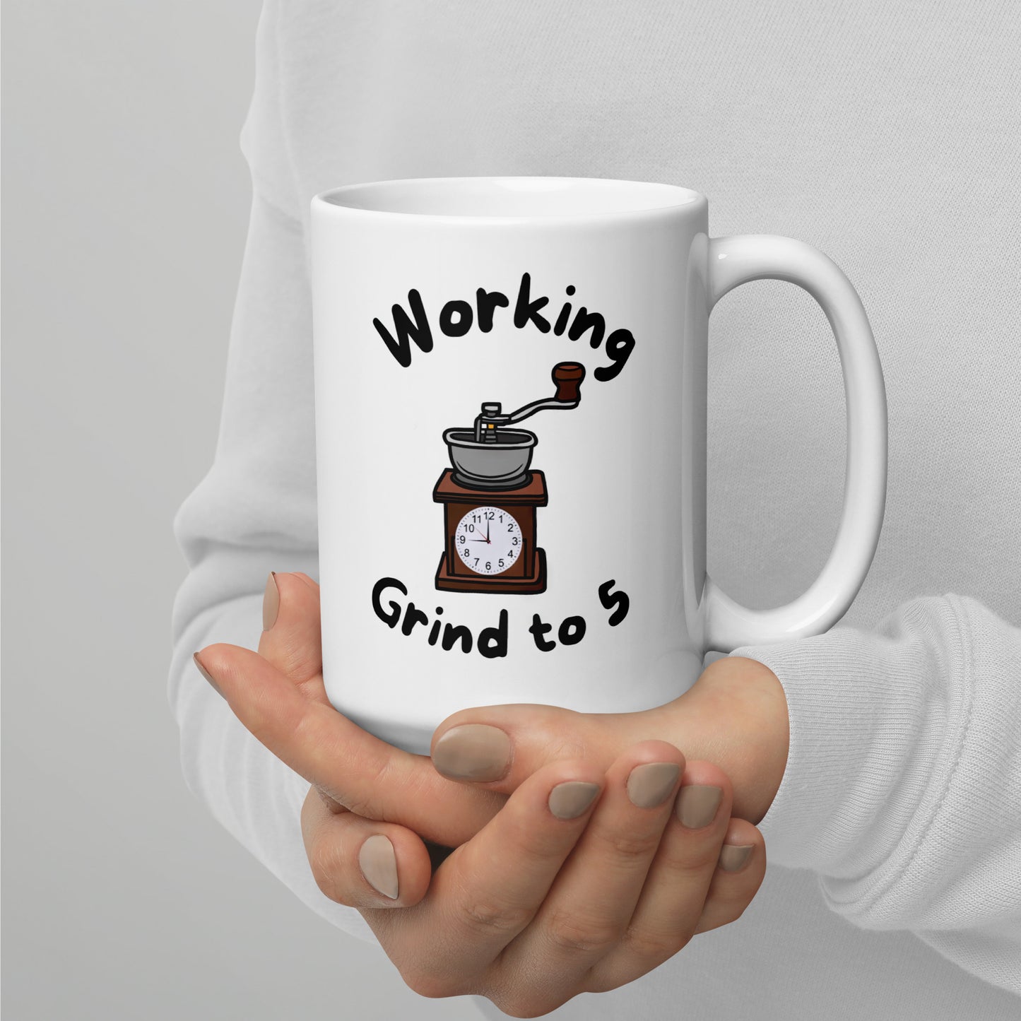 White 15oz tech humor coffee mug with a coffee grinder with a clock face and slogan that says, ‘Working Grind to 5’.