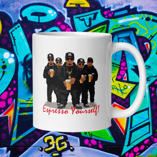 White 11oz retro coffee mug featuring a rap group design with the slogan ‘Espresso Yourself!’ on graffiti background.