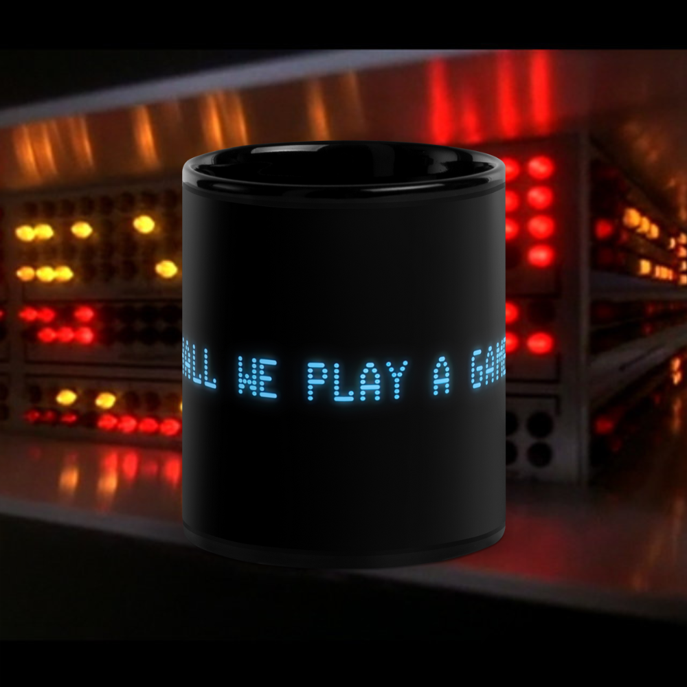 Black 11oz retro coffee mug with the slogan from the 80s movie Wargames, ‘Shall we play a game?’