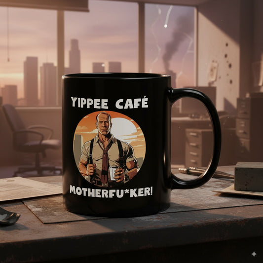 Black mug with graphic design and text on a desk in an office setting