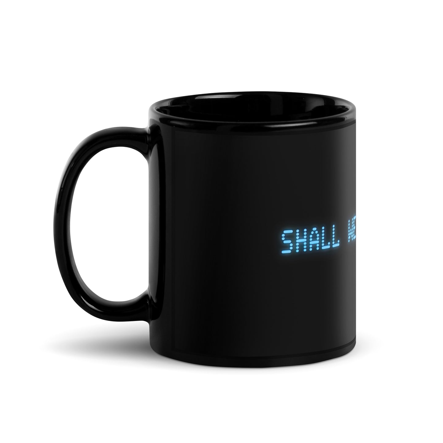 Black 11oz retro coffee mug with the slogan from the 80s movie Wargames, ‘Shall we play a game?’ handle on the left.