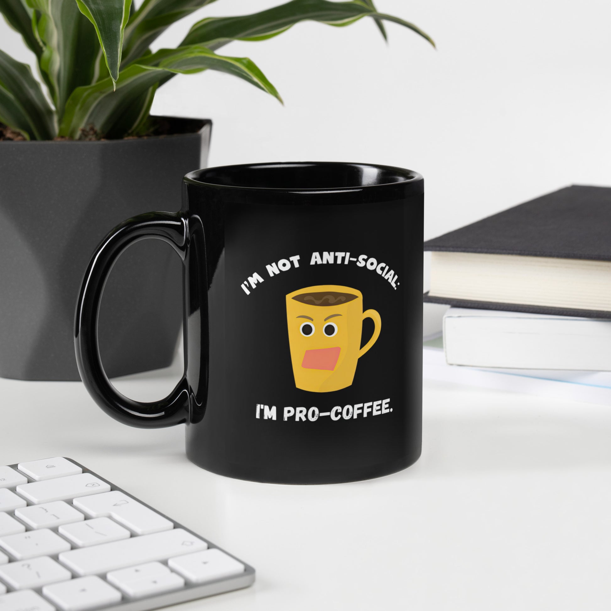 Black 11oz tech humor coffee mug with an angry cartoon coffee mug design that reads ‘I'm not anti-social: I'm pro-coffee’.