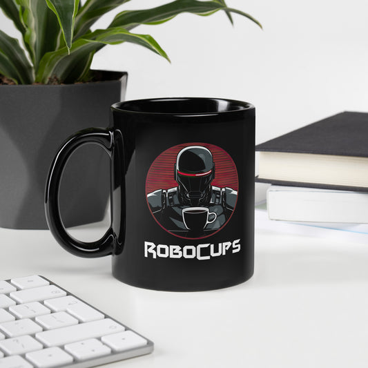 Black 11oz coffee mug with the company logo of RoboCups on it. A robot with coffee mug and the word ‘RoboCups’ underneath.