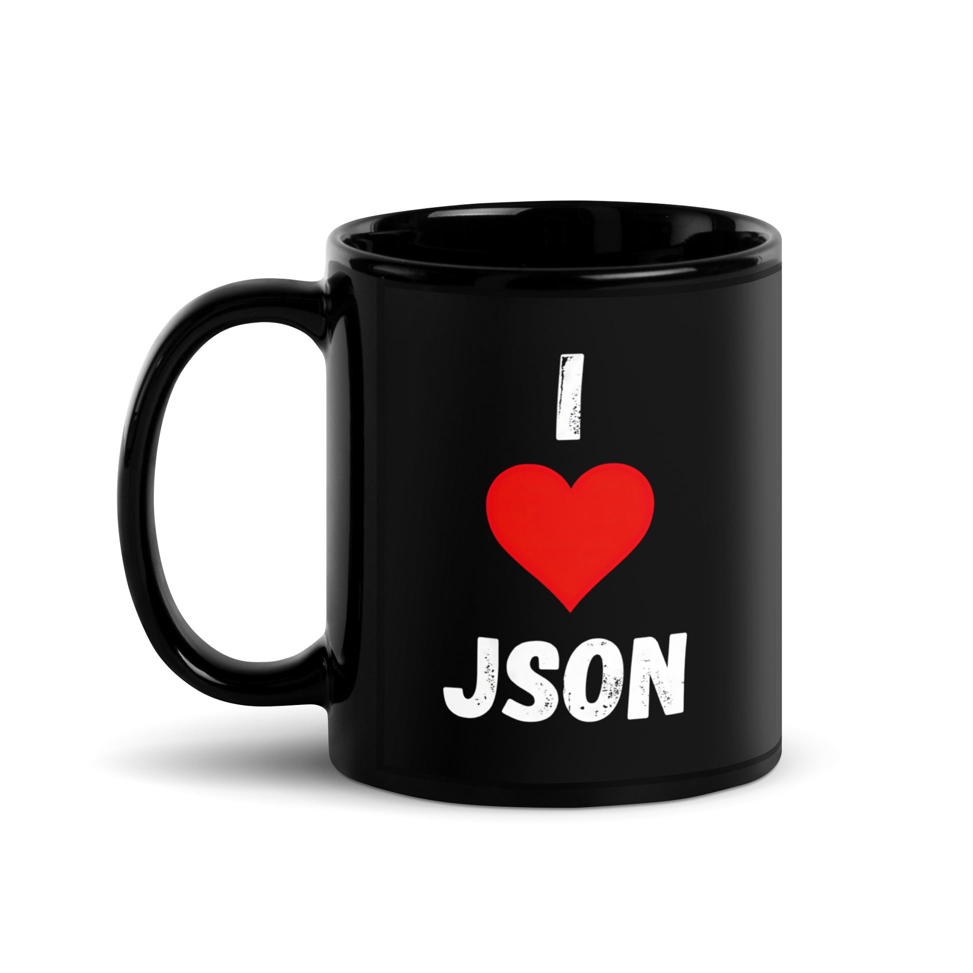 Black 11oz tech humor coffee mug with a design slogan ‘I Love JSON’ with handle on left.
