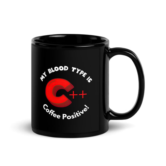 Black 11oz tech humor coffee mug with a C++ graphic and the slogan ‘My Blood Type is Coffee Positive!’ with handle on right.