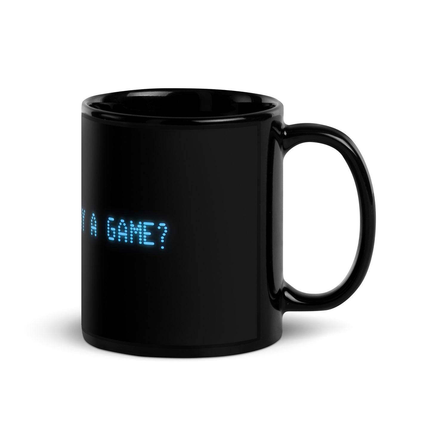 Black 11oz retro coffee mug with the slogan from the 80s movie Wargames, ‘Shall we play a game?’ handle on the right.