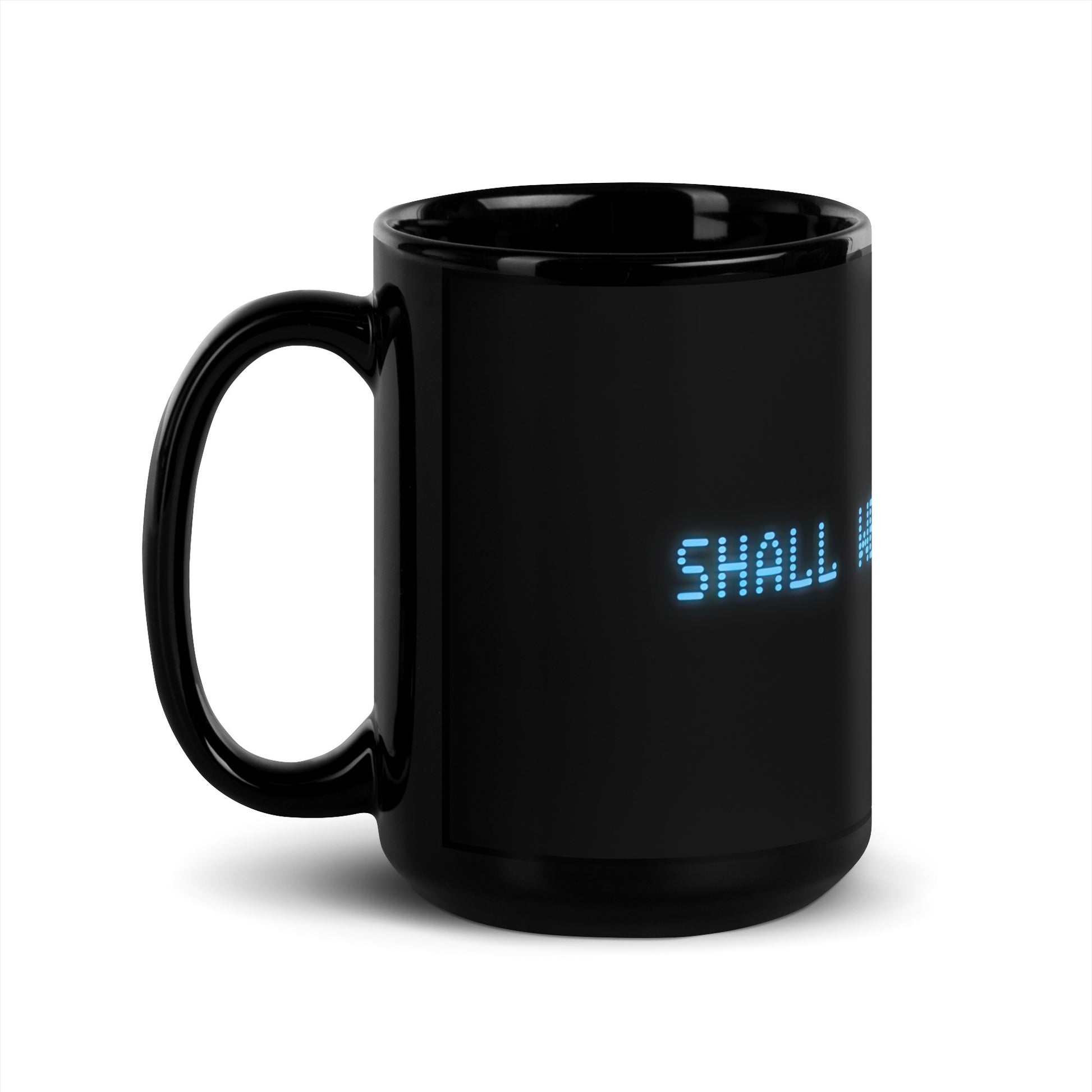 Black 15oz retro coffee mug with the slogan from the 80s movie Wargames, ‘Shall we play a game?’ handle on the left.