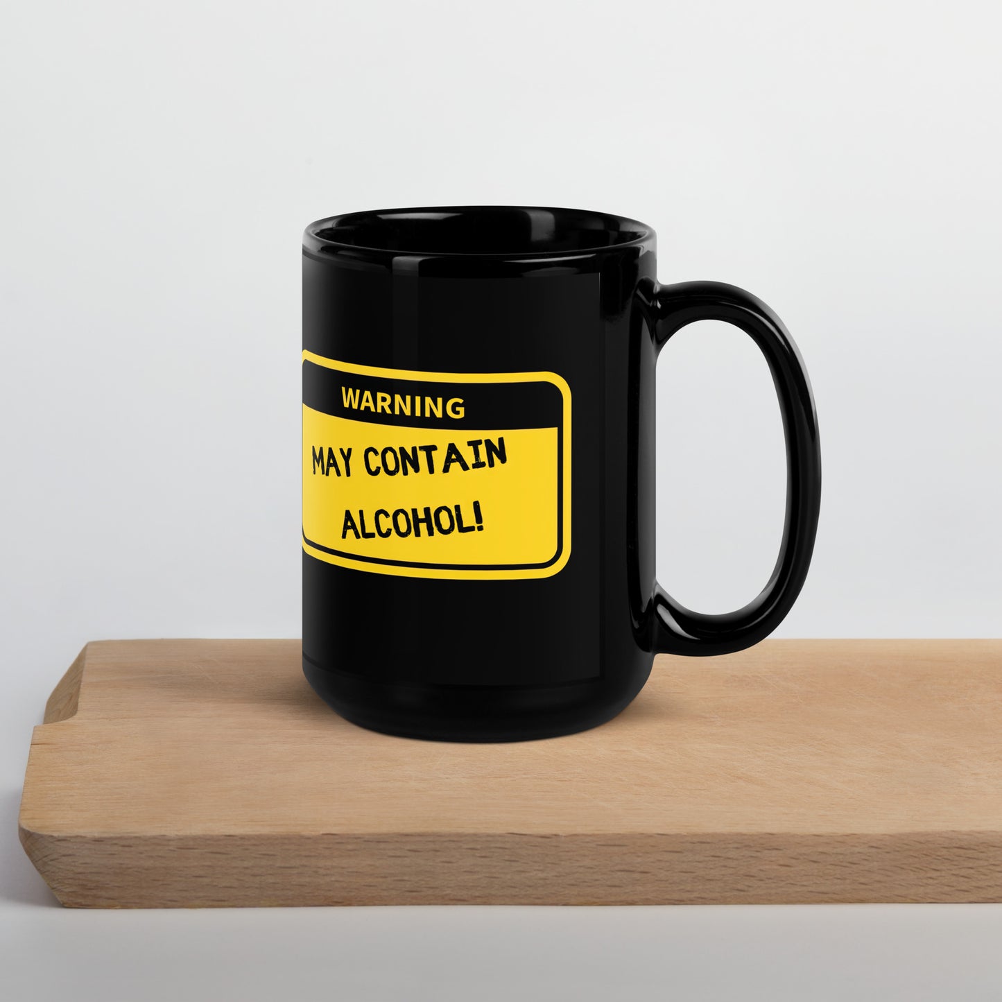 Black 15oz tech humor coffee mug with name label that says, ‘Warning: May Contain Alcohol!’ with handle on right.