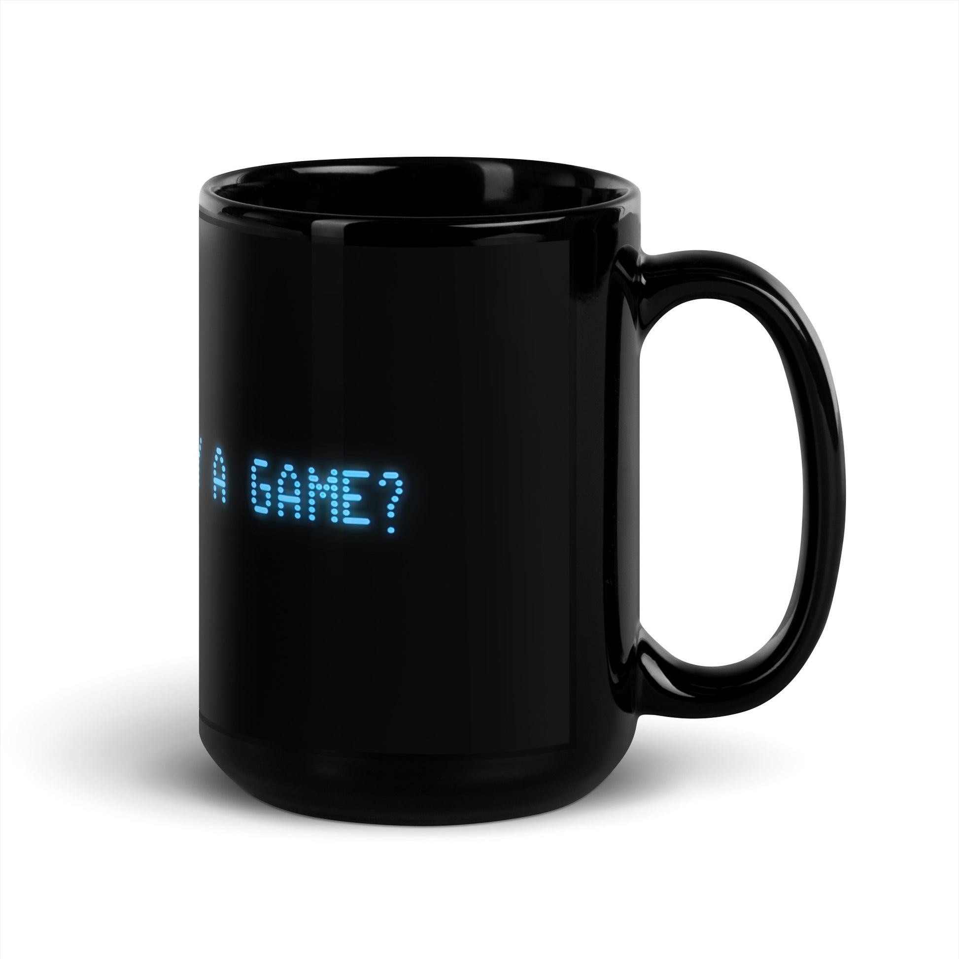 Black 15oz retro coffee mug with the slogan from the 80s movie Wargames, ‘Shall we play a game?’ handle on the right.