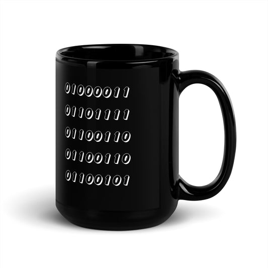 Black 15oz tech humor coffee mug featuring the word “Coffee” written in binary with handle on the right.