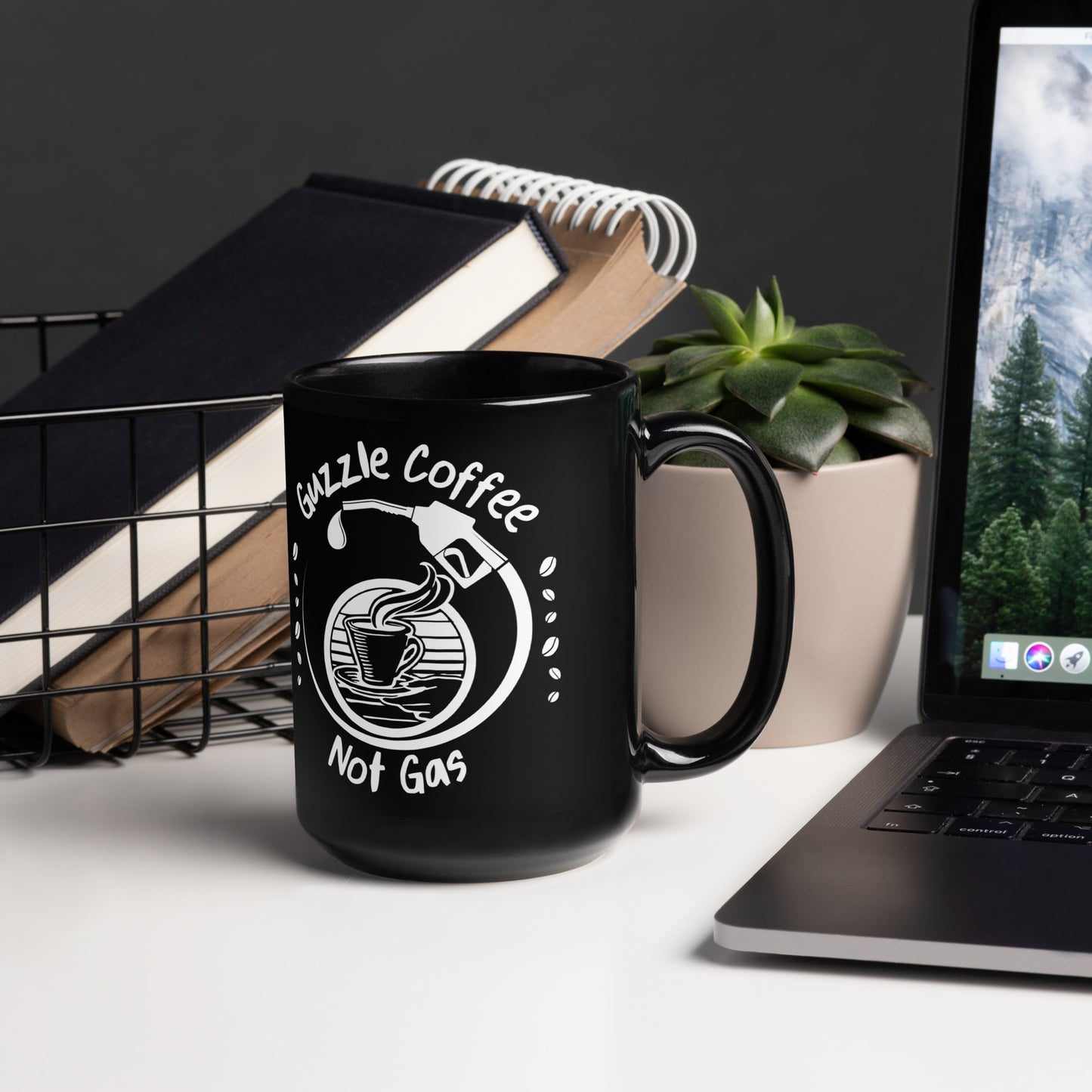 Black 15oz EV themed coffee mug with a gas pump filling a coffee cup and slogan ‘Guzzle Coffee, Not Gas’ with handle on right.