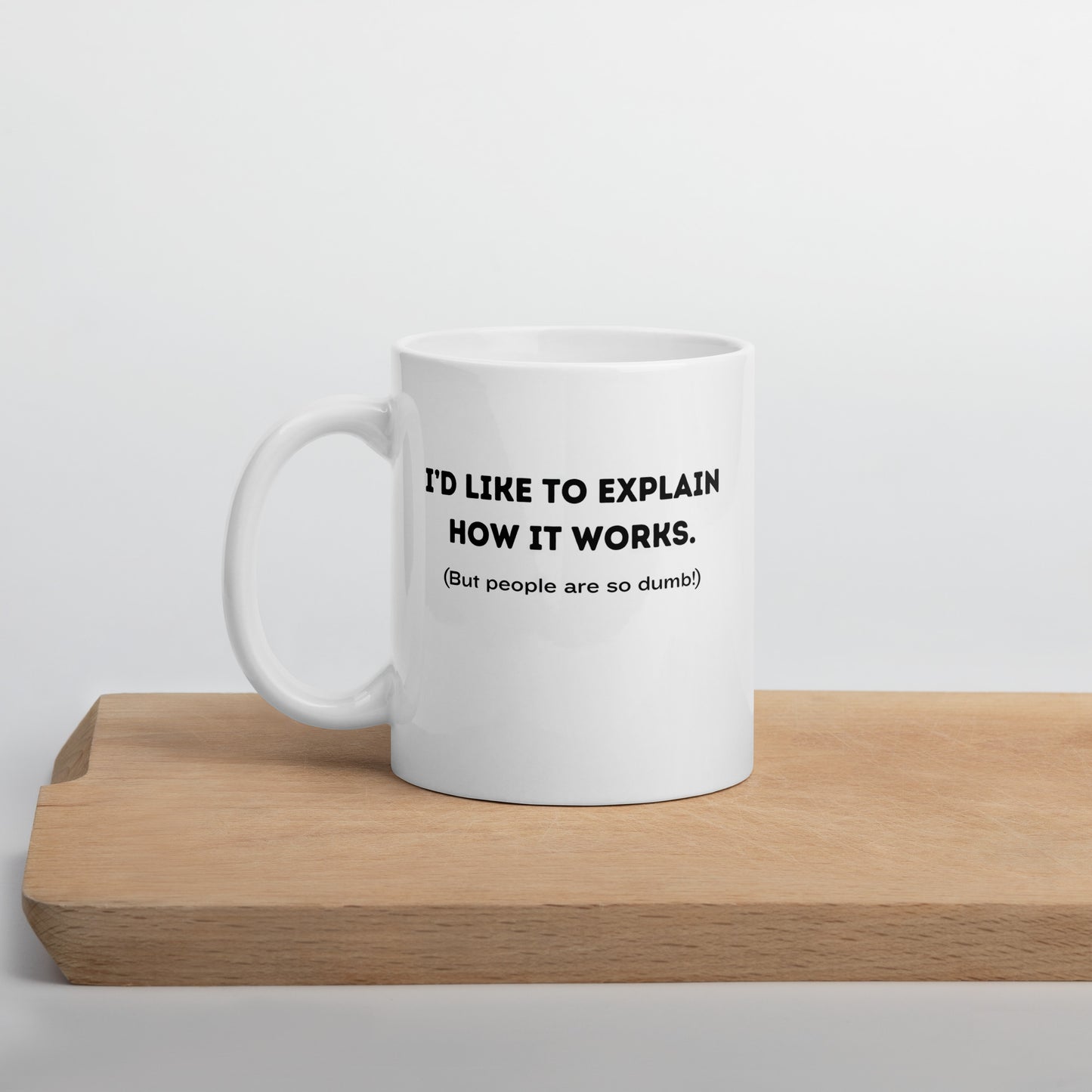 White 11oz tech humor coffee mug with a design that reads ‘I'd Like to Explain How it Works. (But People are so Dumb!)’