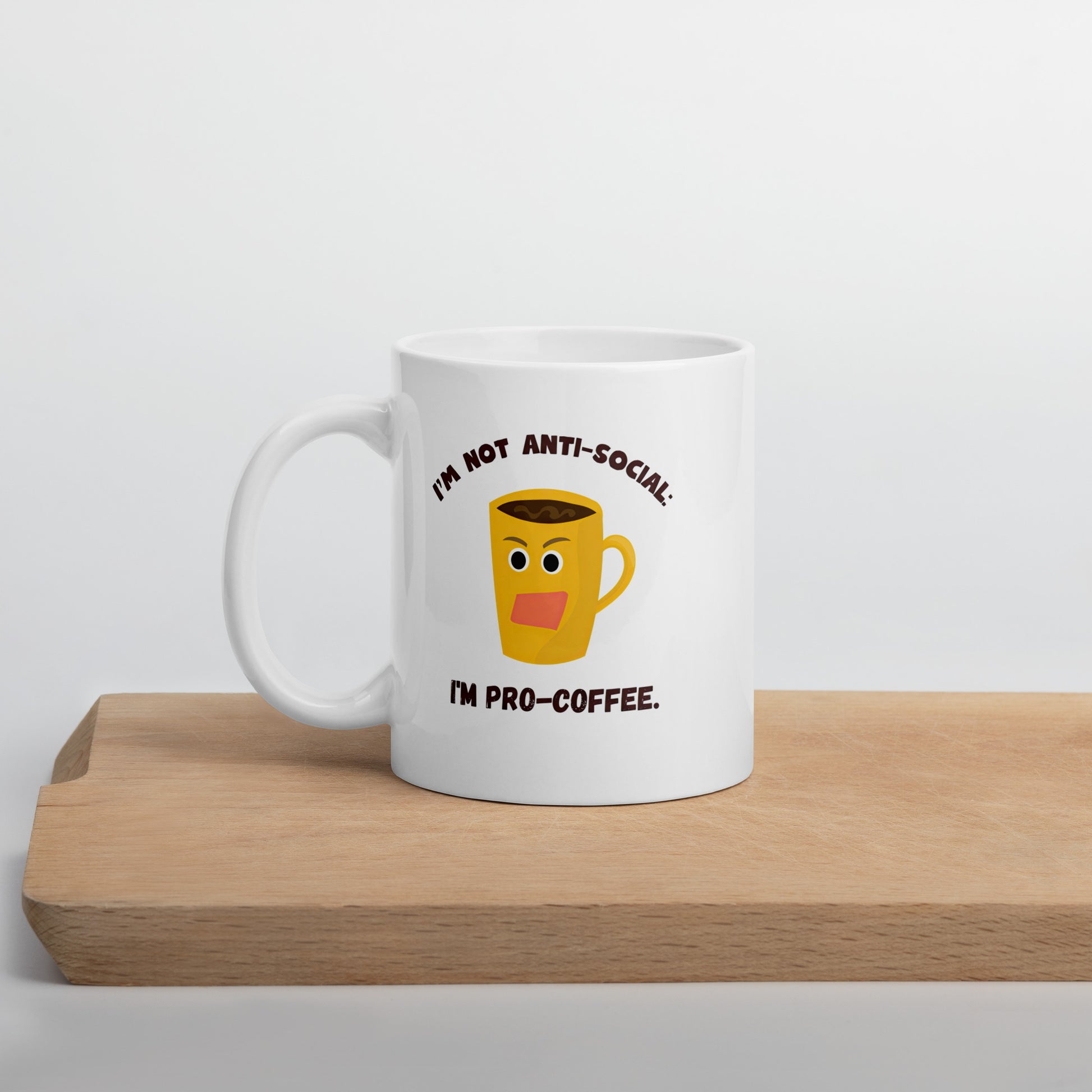 White 11oz tech humor coffee mug with an angry cartoon coffee mug design that reads ‘I'm not anti-social: I'm pro-coffee’.