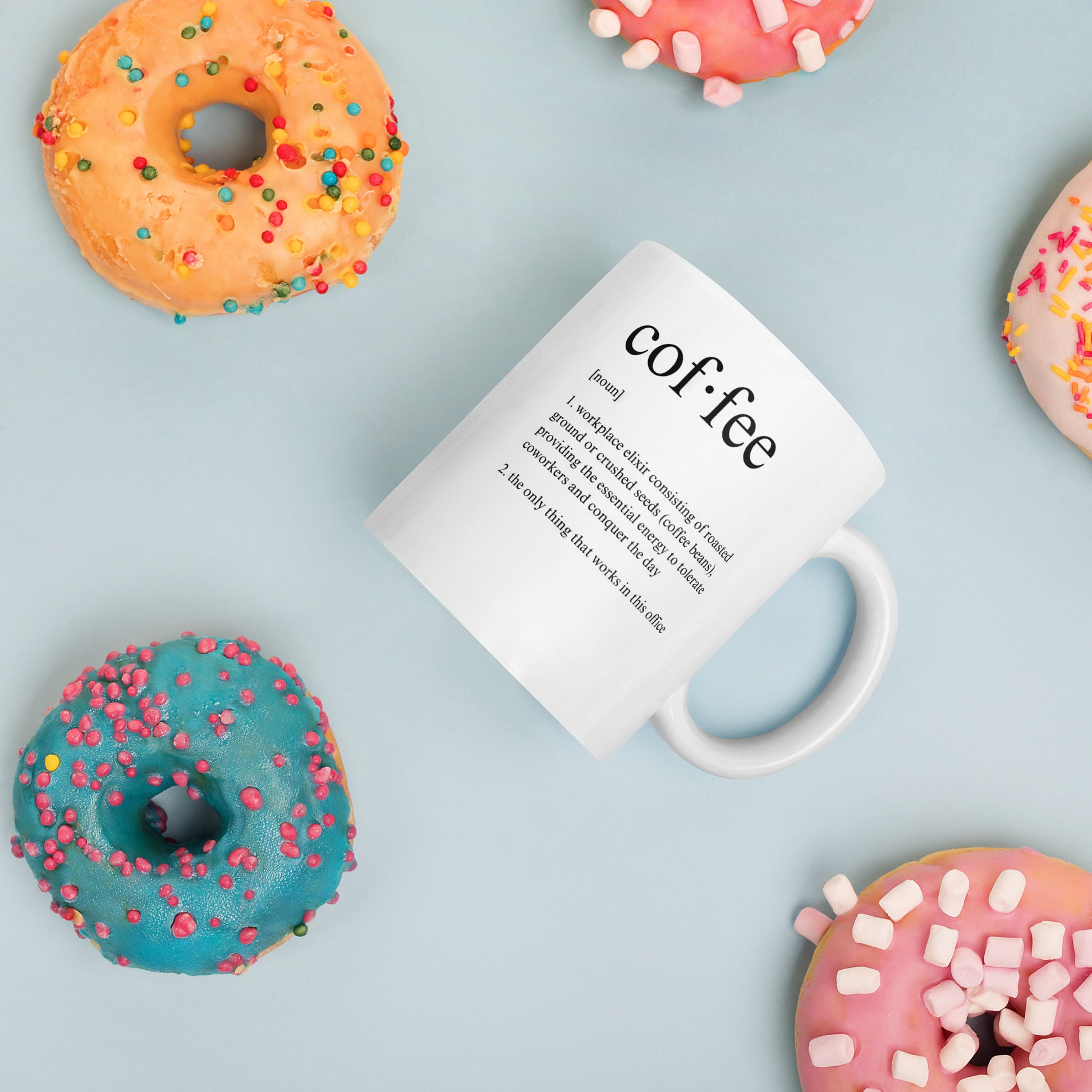 White 11oz tech humor coffee mug featuring a ‘Dictionary Definition Coffee & Coworkers’ design surrounded by donuts.