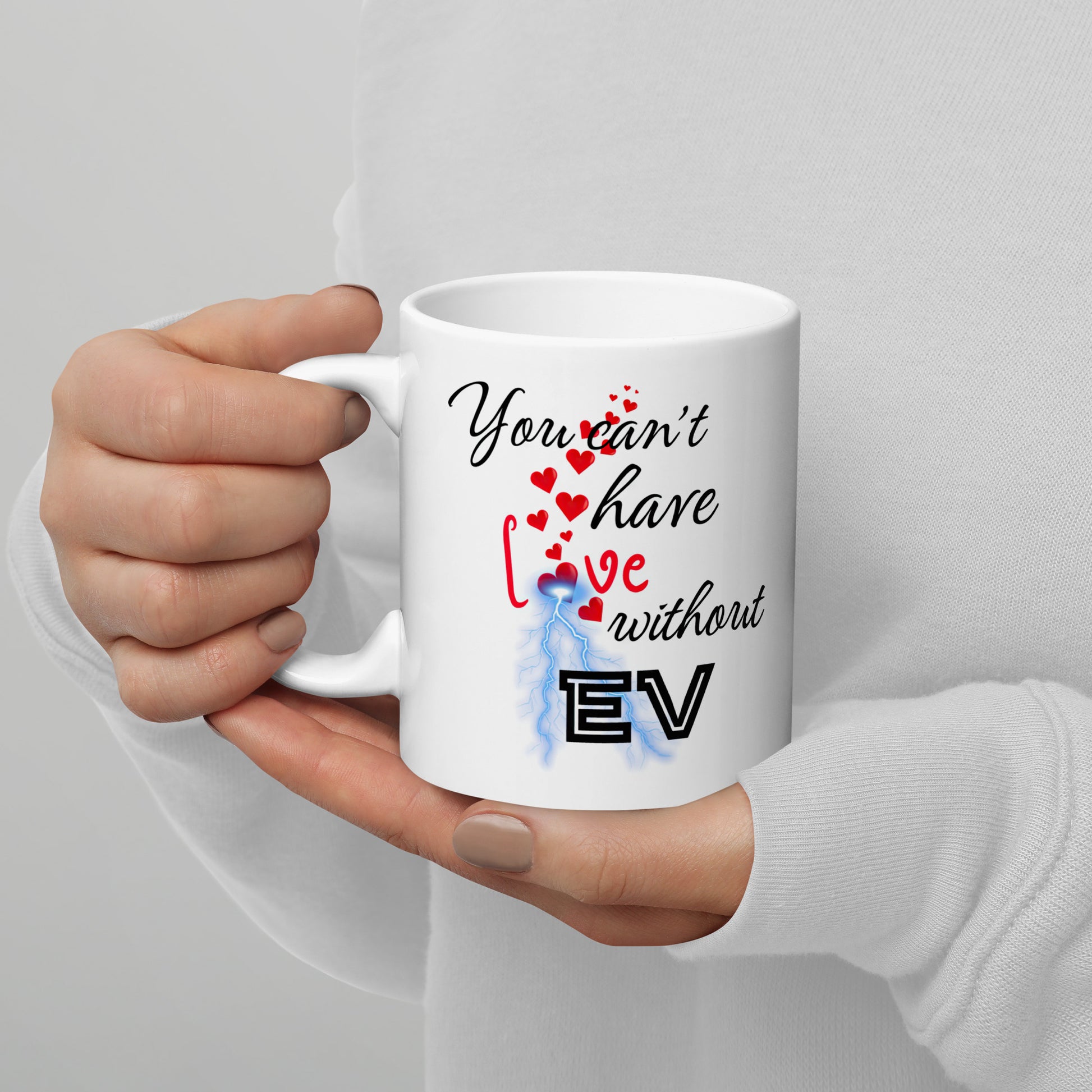 White 11oz EV themed coffee mug with an electrical bolt design that says, ‘You Can't Have Love Without EV’.