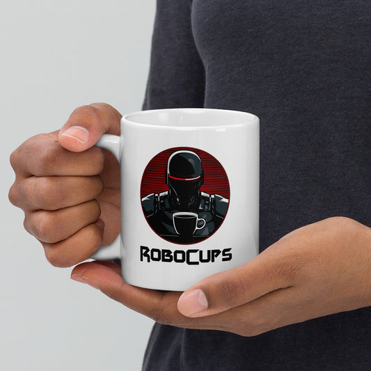 White 11oz coffee mug with the company logo of RoboCups on it. A robot with coffee mug and the word ‘RoboCups’ underneath.