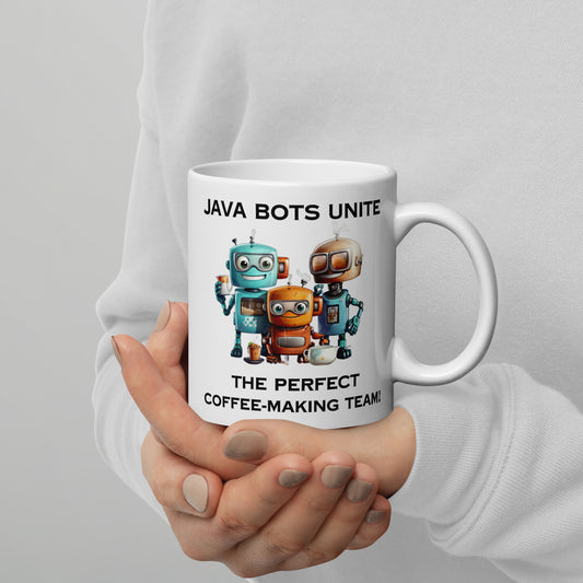 White 11oz robot coffee mug with a group of robot baristas that reads ‘Java Bots Unite: The Perfect Coffee-Making Team!’