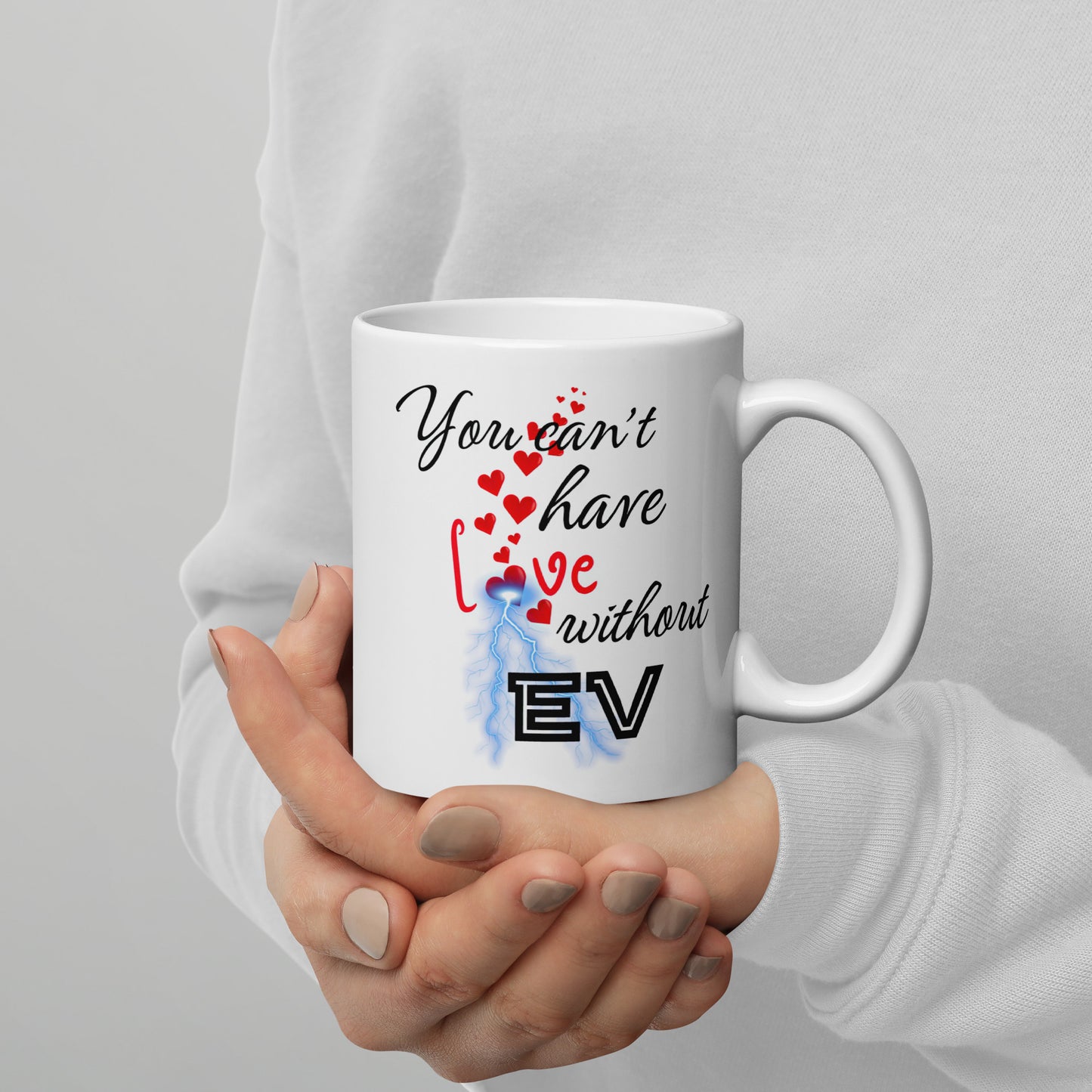 White 11oz EV themed coffee mug with an electrical bolt design that says, ‘You Can't Have Love Without EV’.