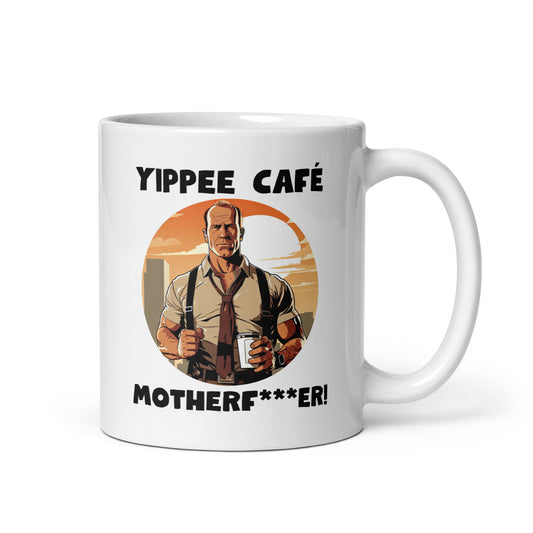 White 11oz retro coffee mug with an 80s Die Hard cop holding a coffee mug and slogan that says, ‘Yippee Cafe Motherfu*ker!’