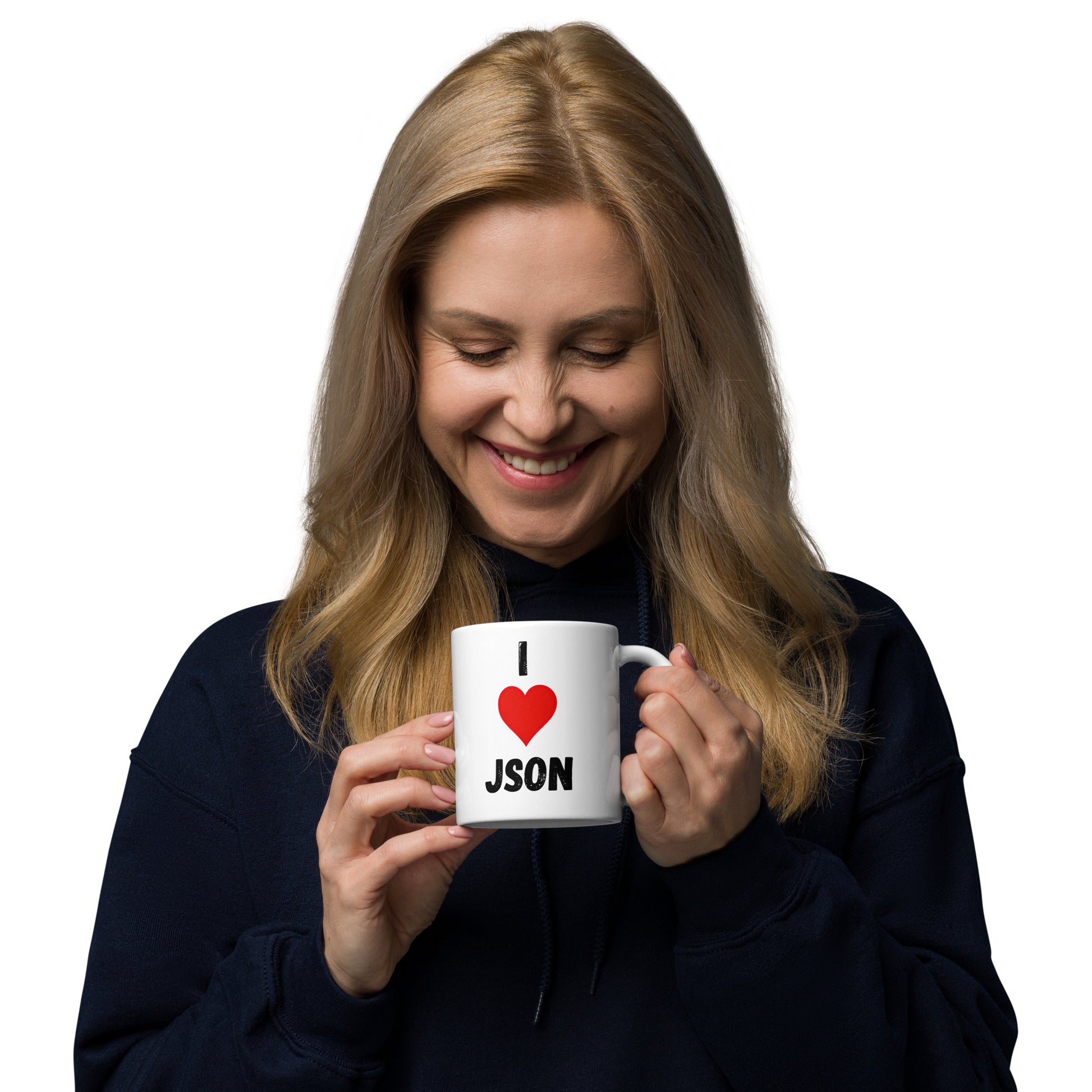 White 11oz tech humor coffee mug with a design slogan ‘I Love JSON’ with handle on left held by laughing woman.