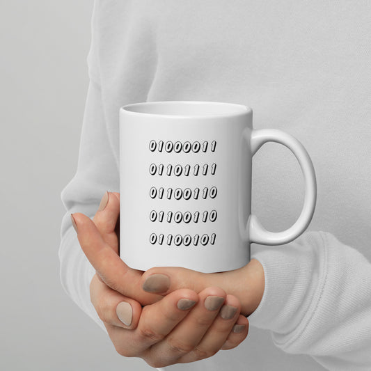 White 15oz tech humor coffee mug featuring the word “Coffee” written in binary with handle on the right.