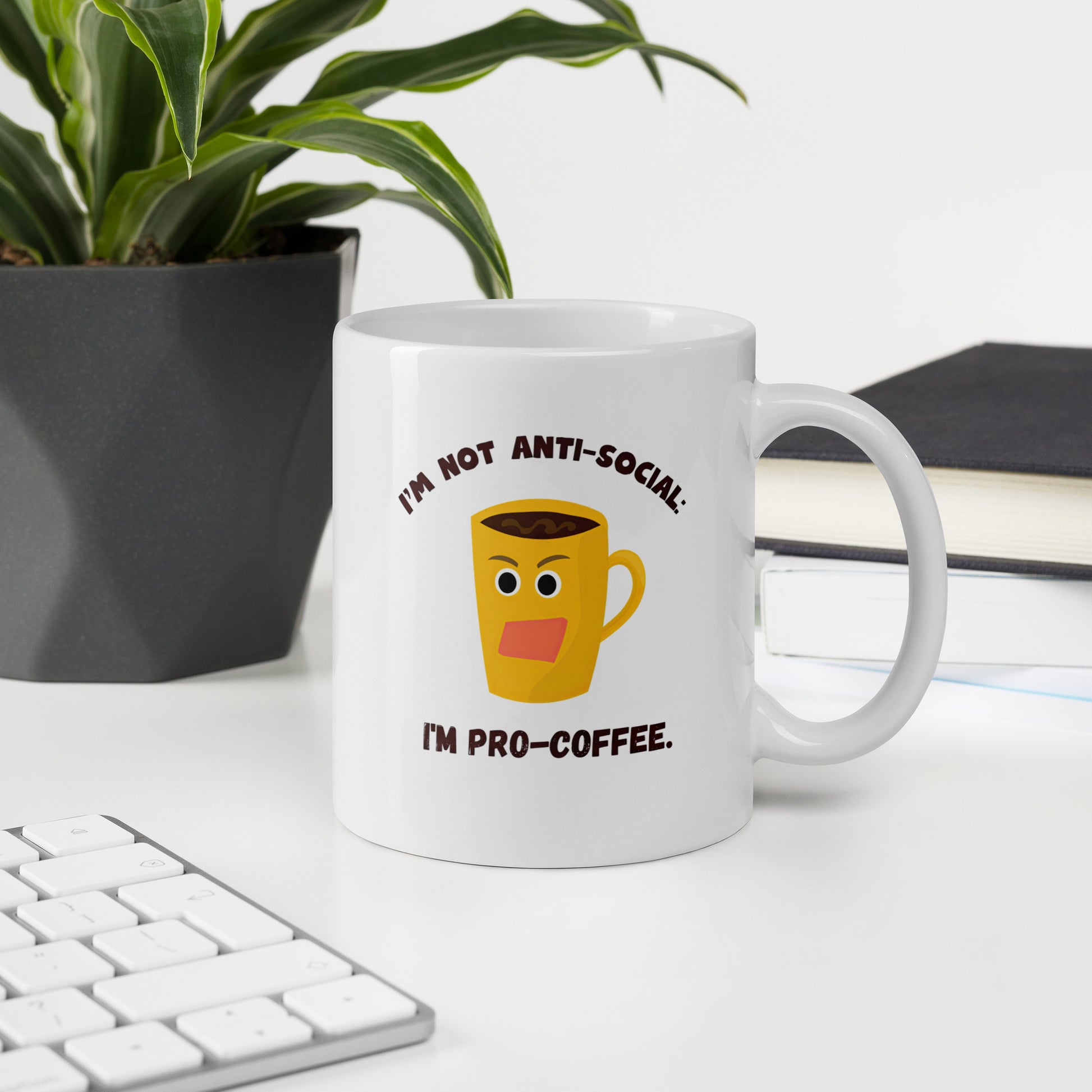 White 11oz tech humor coffee mug with an angry cartoon coffee mug design that reads ‘I'm not anti-social: I'm pro-coffee’.