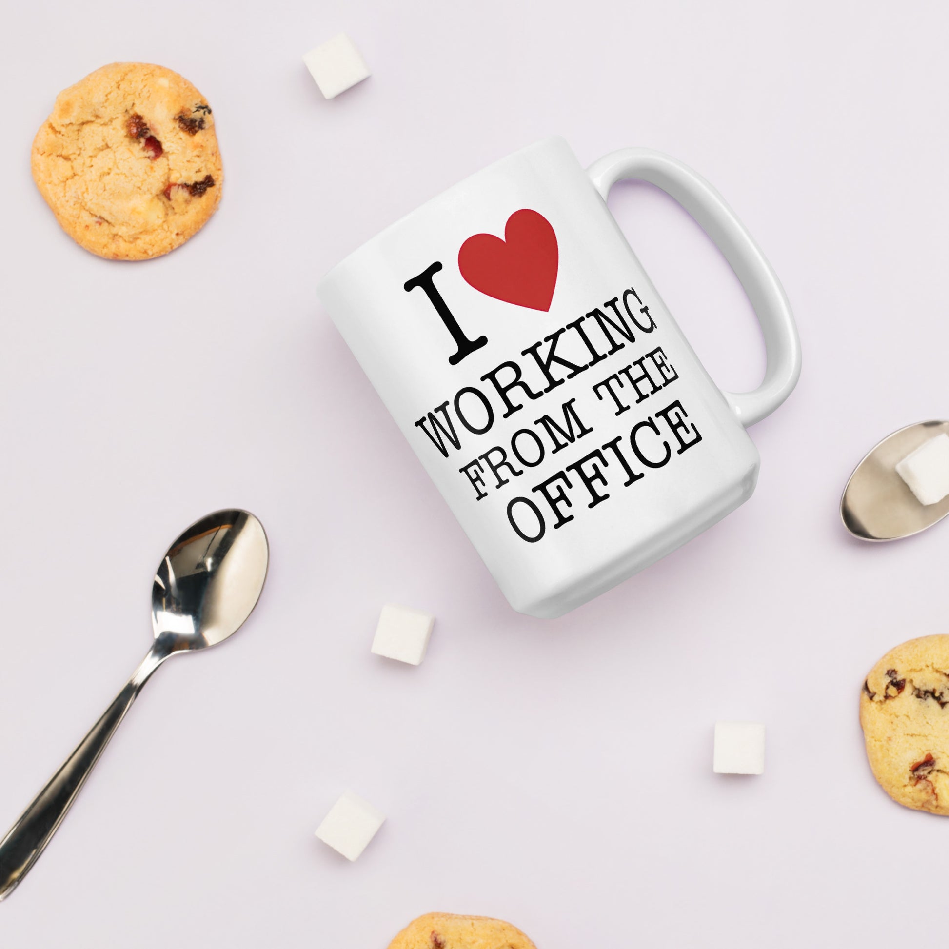 White 11oz tech humor coffee mug with an I Love NY style design that reads ‘I Love Working From the Office’ handle on right.