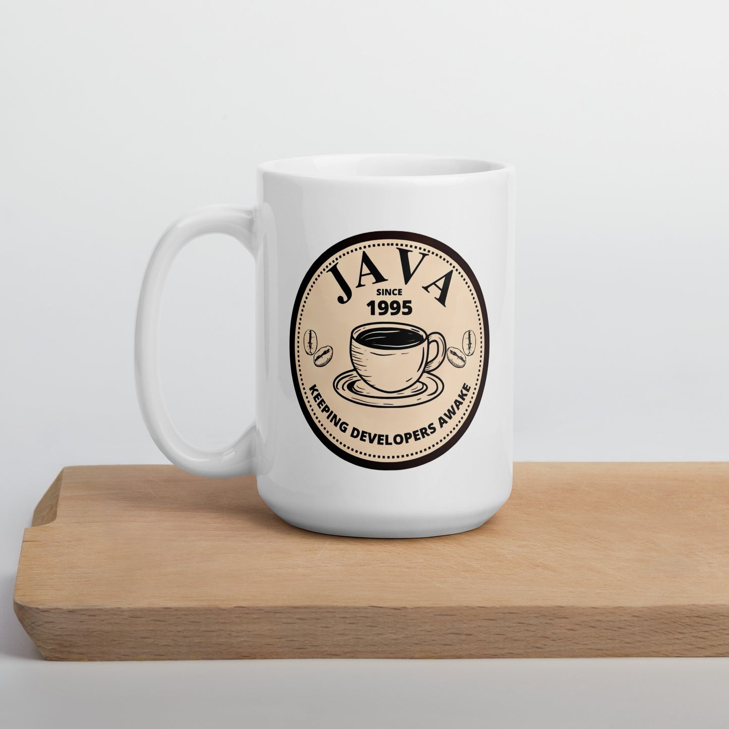 White 15oz tech humor coffee mug with an antique coffee shop logo that reads ‘Java: Keeping Developers Awake Since 1995’.