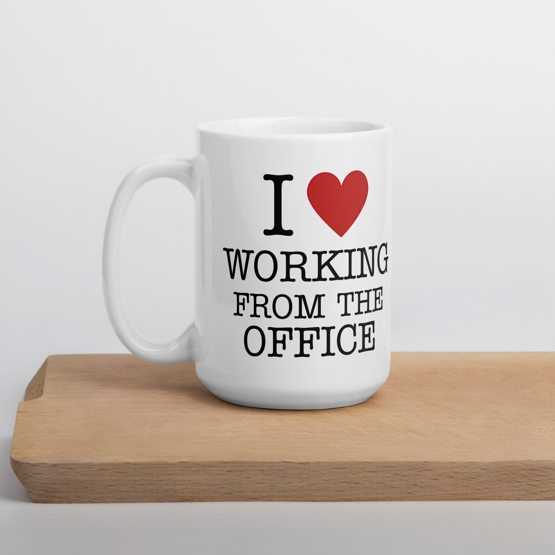 White 15oz tech humor coffee mug with an I Love NY style design that reads ‘I Love Working From the Office’ handle on left.