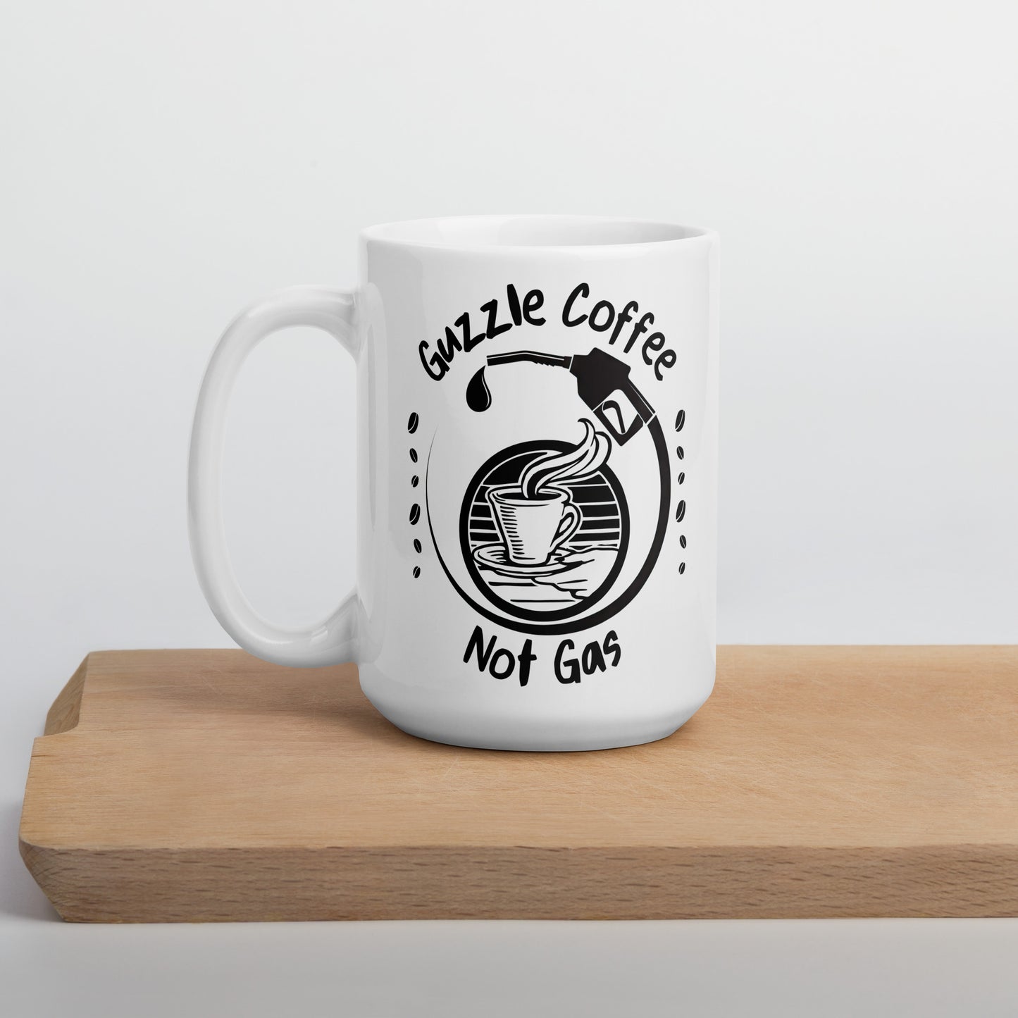 White 15oz EV themed coffee mug with a gas pump over a coffee cup and slogan ‘Guzzle Coffee, Not Gas’ with handle on left.