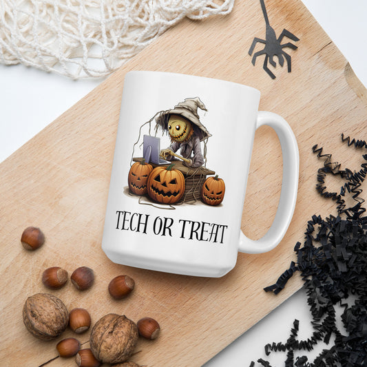 White 15oz tech humor horror coffee mug with a scarecrow on laptop surrounded by pumpkins and the slogan ‘Tech or Treat’.