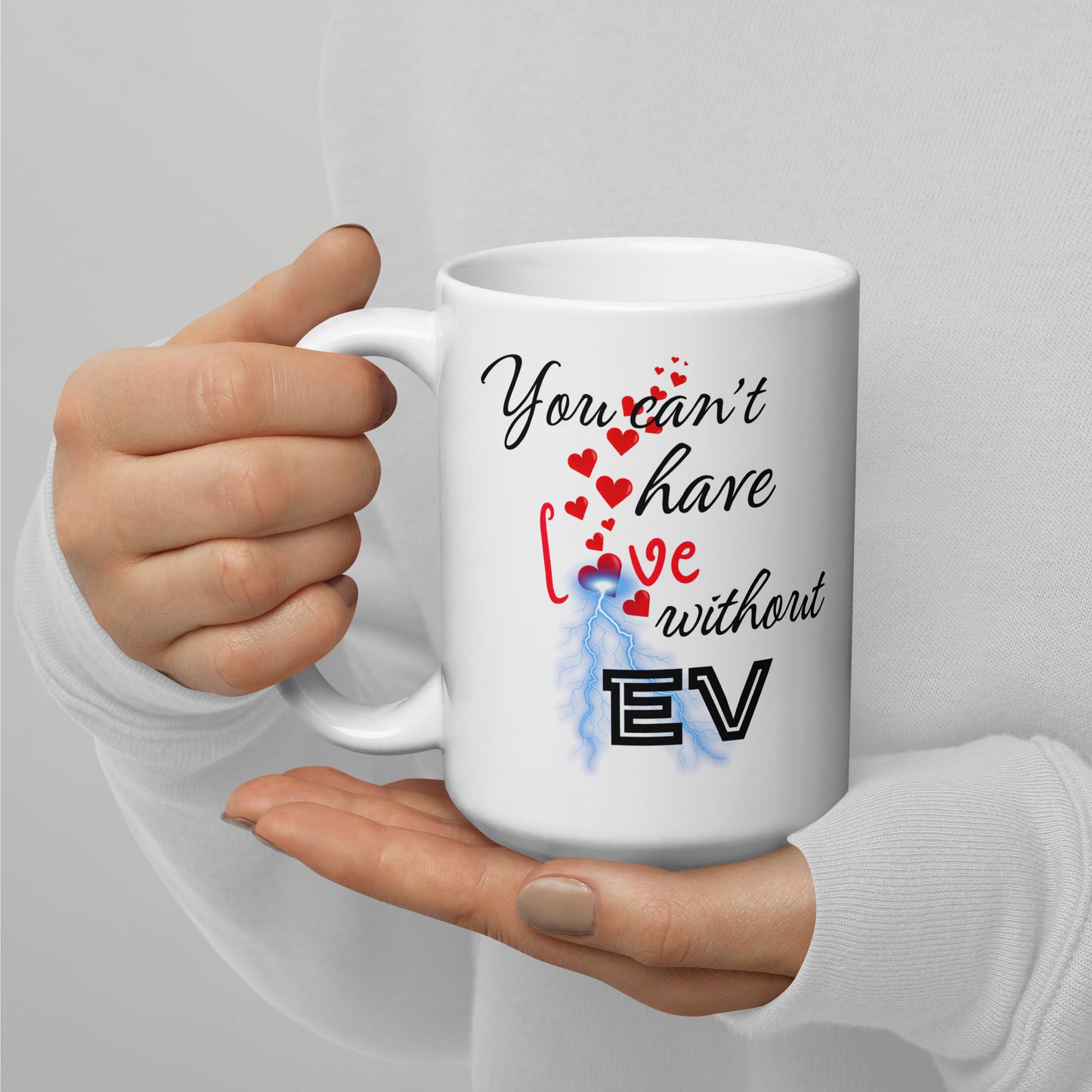 White 15oz EV themed coffee mug with an electrical bolt design that says, ‘You Can't Have Love Without EV’.