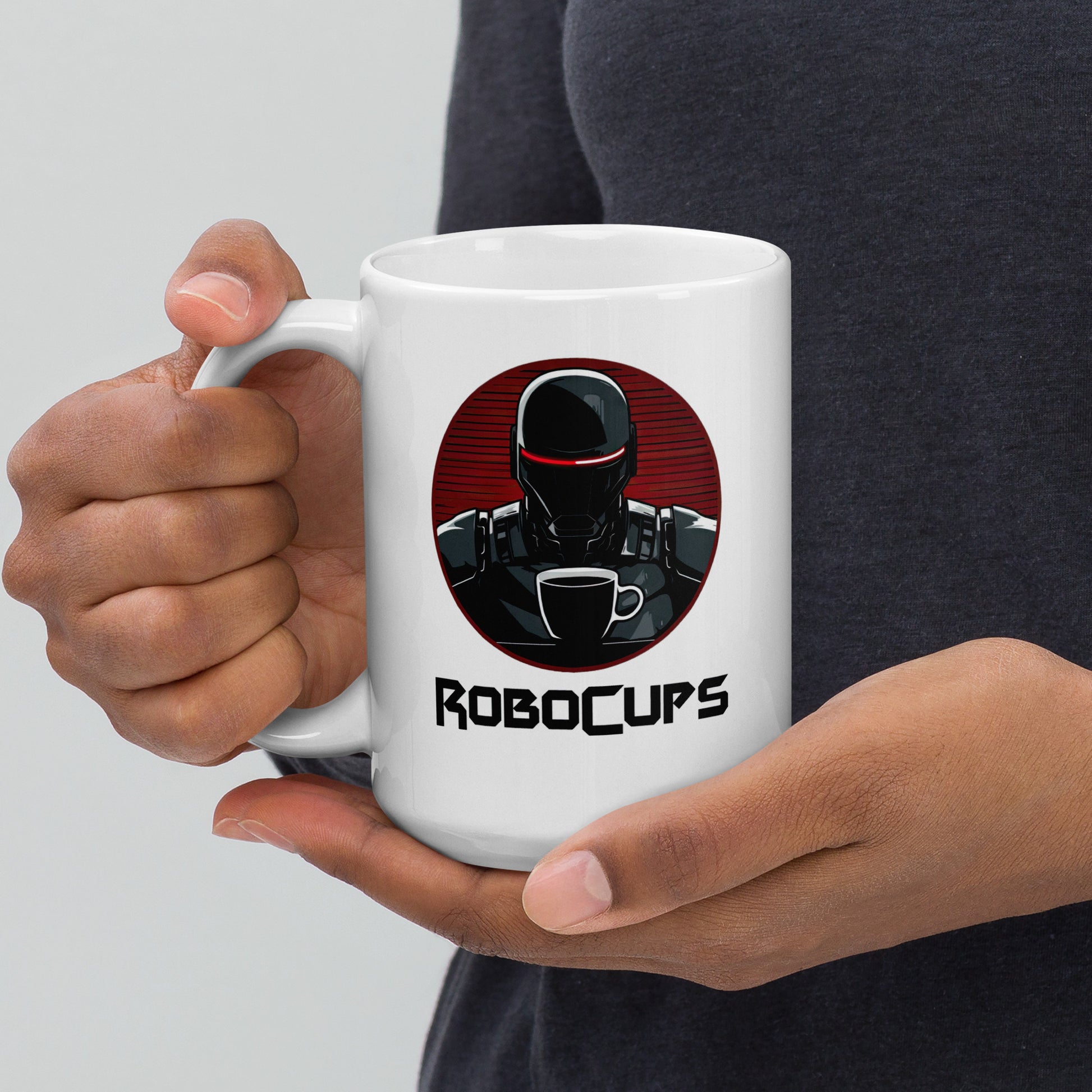 White 15oz coffee mug with the company logo of RoboCups on it. A robot with coffee mug and the word ‘RoboCups’ underneath.