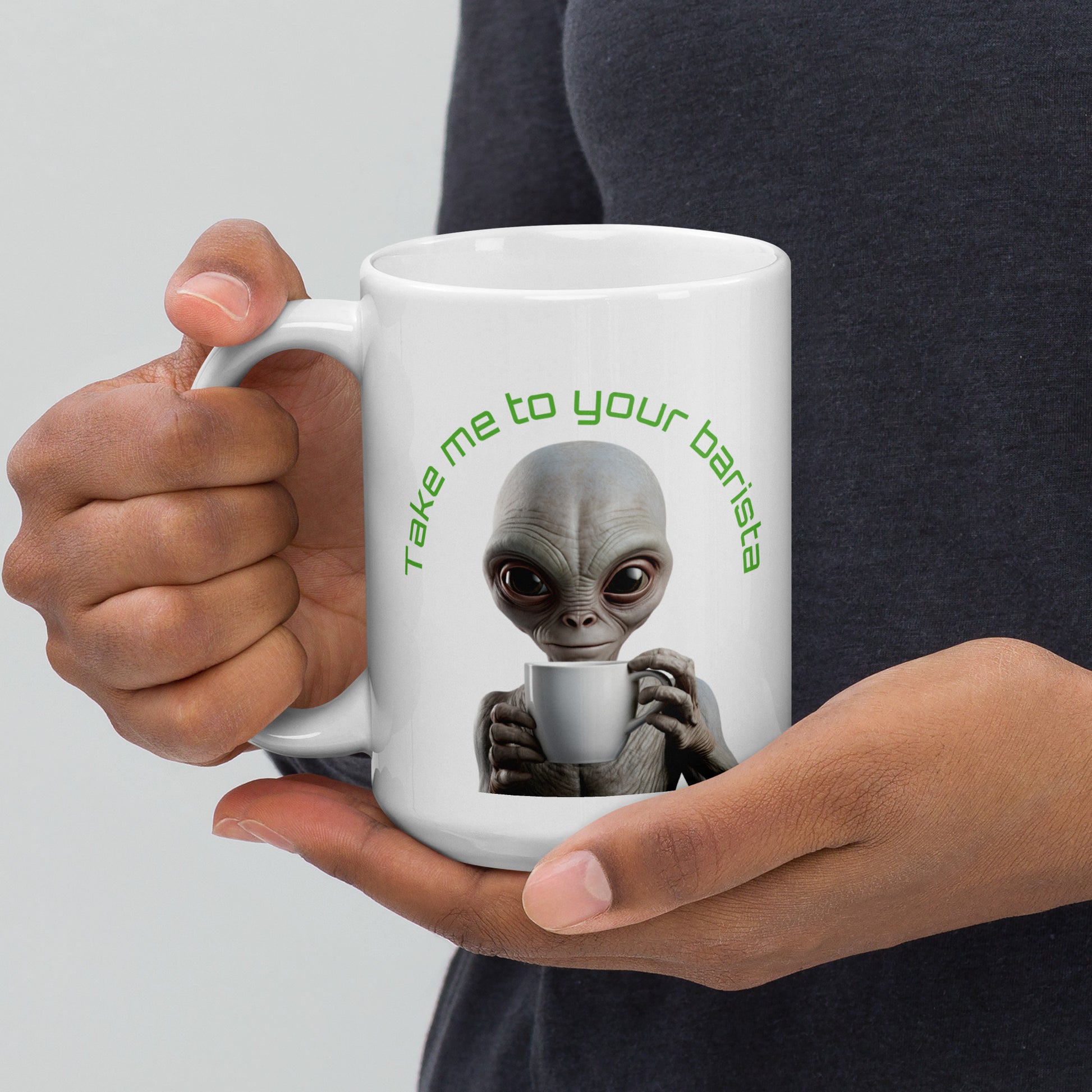 White 15oz sci-fi coffee mug with an alien holding a coffee cup and the slogan ‘Take me to your barista’ handle on the left.