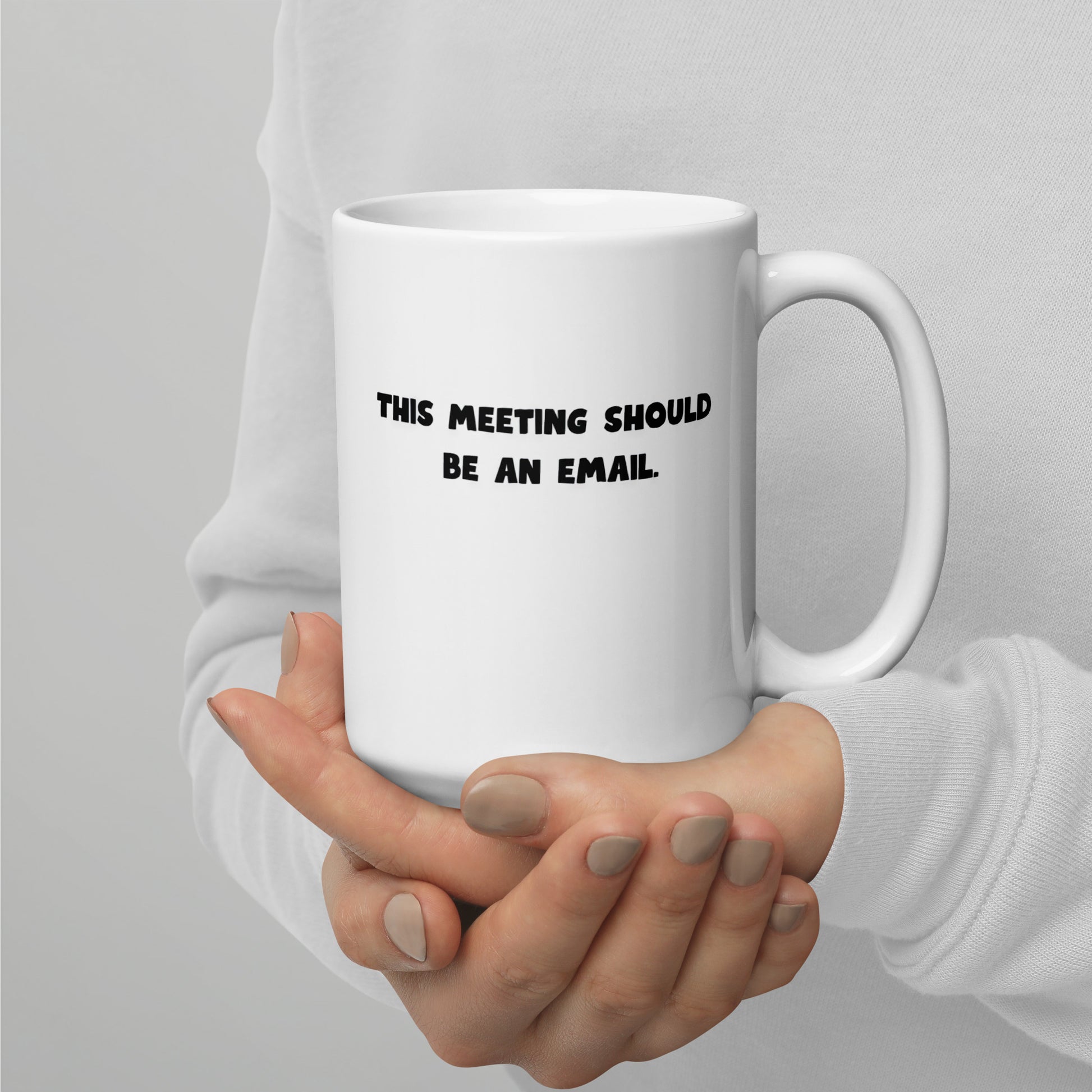 White 15oz tech humor coffee mug with the slogan ‘This Meeting Should Be An Email’ with handle on right.