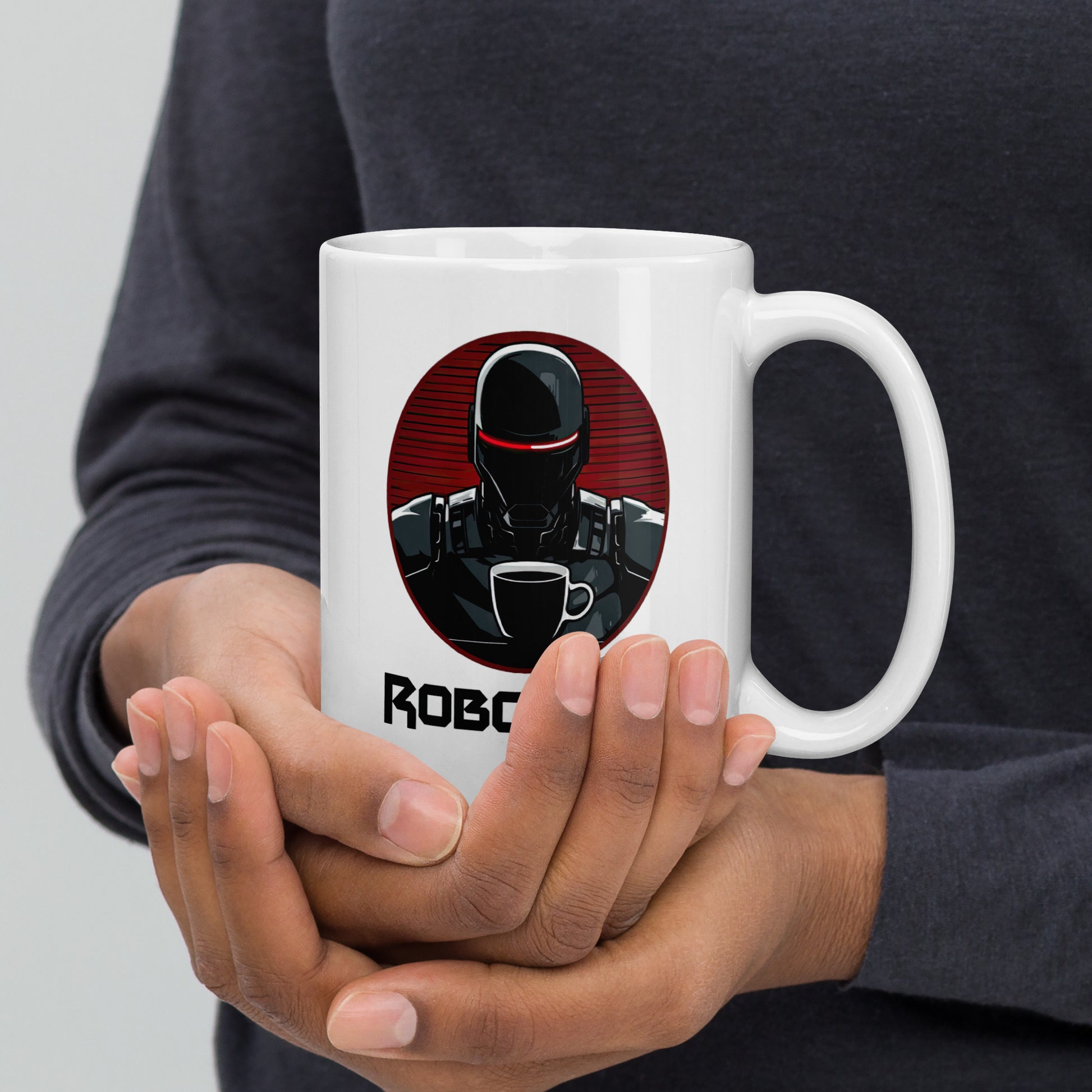 White 15oz coffee mug with the company logo of RoboCups on it. A robot with coffee mug and the word ‘RoboCups’ underneath.