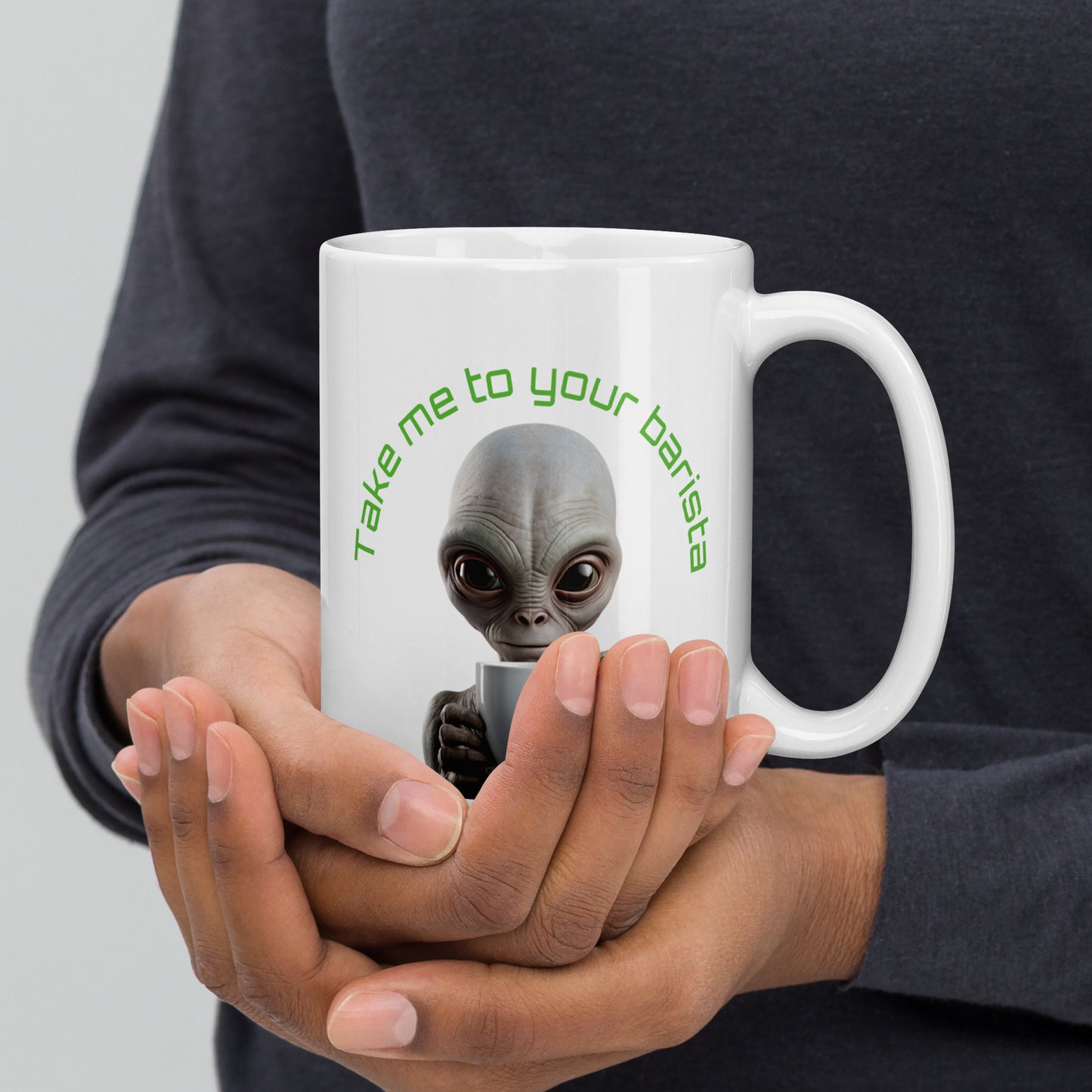 White 15oz sci-fi coffee mug with an alien holding a coffee cup and the slogan ‘Take me to your barista’ handle on the right.