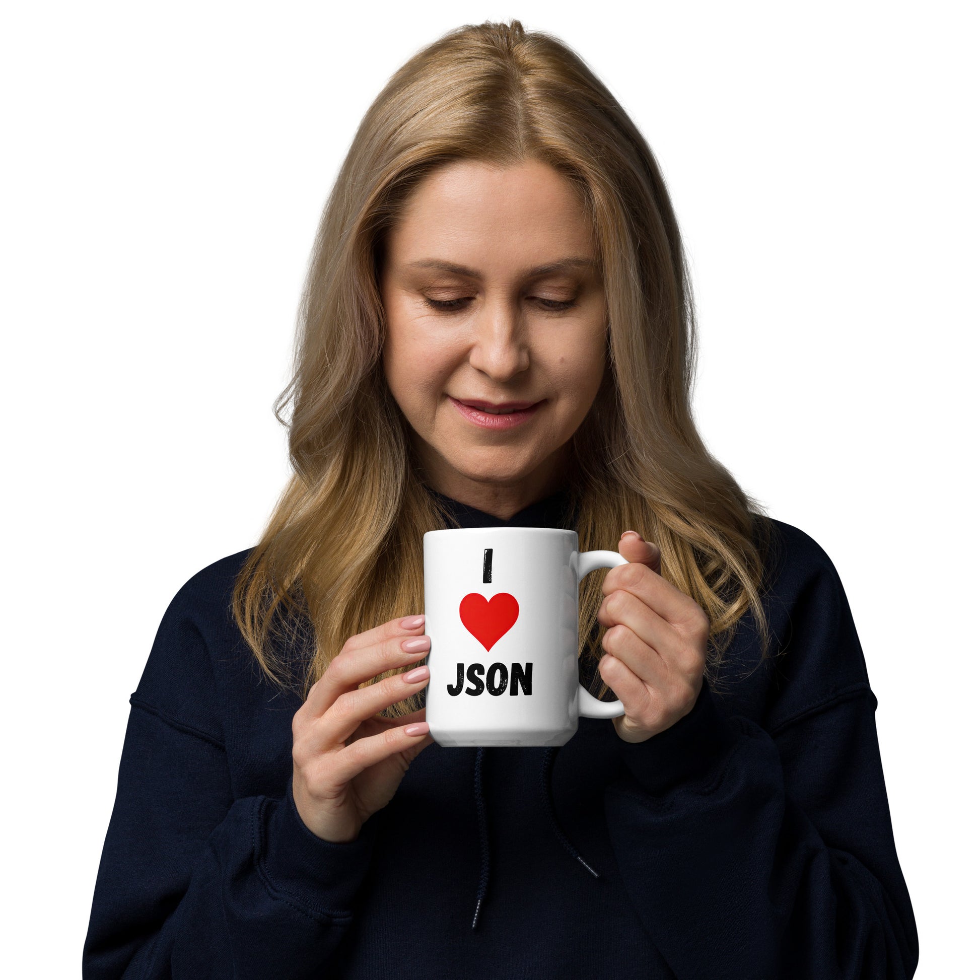 White 15oz tech humor coffee mug with a design slogan ‘I Love JSON’ with handle on right held by woman.