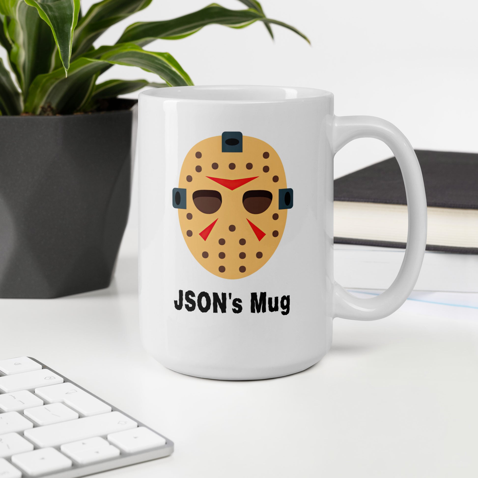 White 15oz tech humor horror coffee mug with a hockey mask design that reads ‘JSON's Mug’ handle on the right.