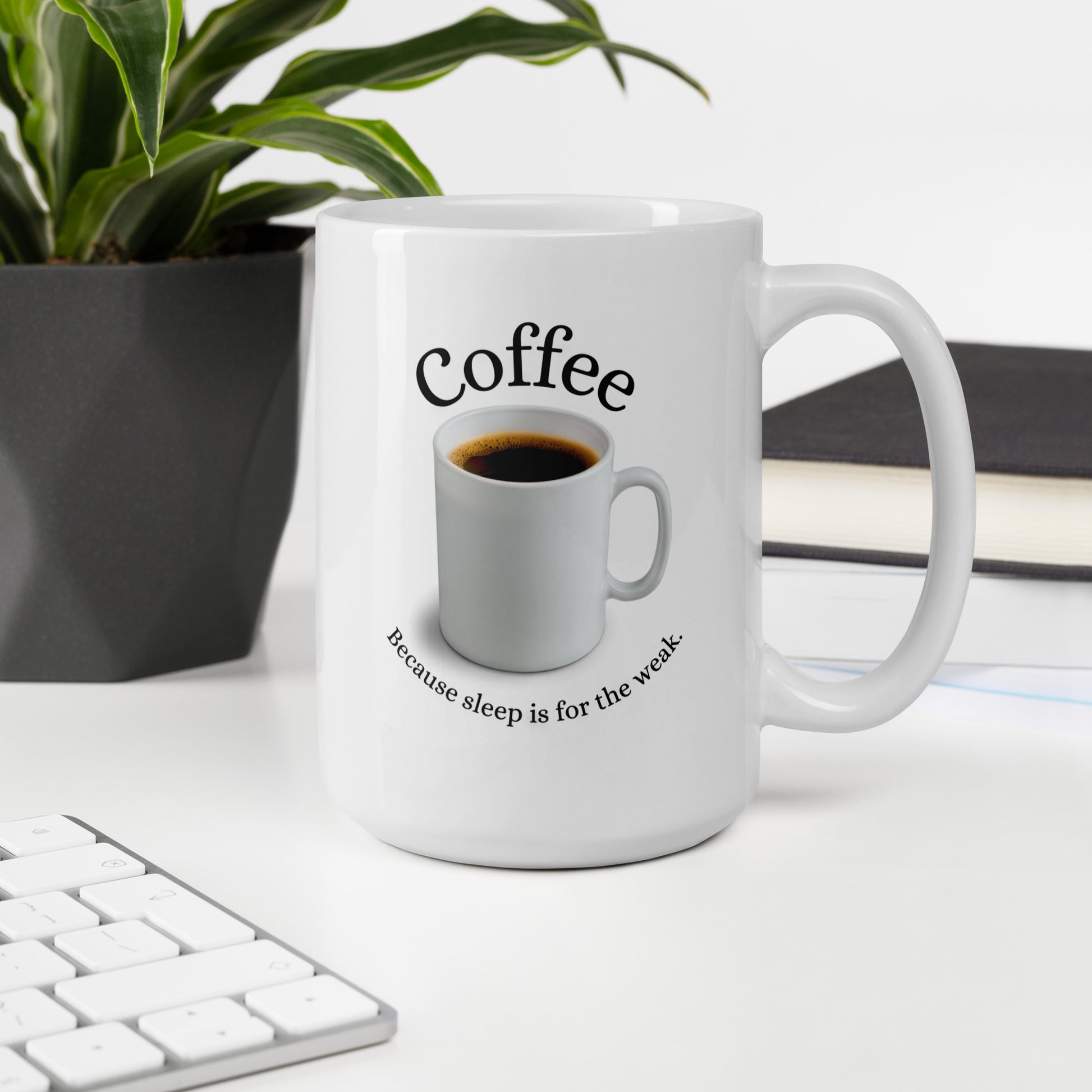 White 15oz tech humor coffee mug featuring slogan “Coffee: Because Sleep is for the Weak” with handle on the right on desk.